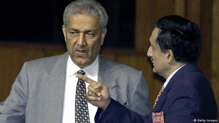 (FILES) This file picture taken on January 6, 2004 shows the father of Pakistan's nuclear bomb Abdul Qadeer Khan (L) talking to an unidentified official during the closing session of the South Asian Association for Regional Cooperation (SAARC) summit in Islamabad. Disgraced Pakistani nuclear scientist Khan, who underwent cancer surgery two years ago, has been hospitalised with a suspected infection, the army said on March 5, 2008. Khan, the father of Pakistan's nuclear weapons programme, has been under house arrest since early 2004 when he confessed to passing atomic secrets to Iran, North Korea and Libya. AFP PHOTO/Aamir QURESHI (Photo credit should read AAMIR QURESHI/AFP/Getty Images) 