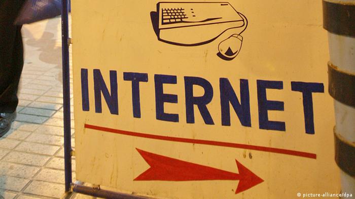 sign at entrance of an Internet cafe
