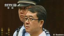 Former police chief Wang Lijun attends a court hearing in Chengdu in this still image taken from video September 18, 2012. The former police chief at the heart of China's biggest political uproar in decades did not contest charges against him at his court hearing on Tuesday, an official said. Wang fled to a U.S. consulate in Chengdu for more than 24 hours in February, days after his dismissal as police chief of Chongqing, the nearby municipality then run by ambitious politician Bo Xilai, who had raised Wang to prominence as a crime gang-buster. REUTERS/CCTV via Reuters TV (CHINA - Tags: CRIME LAW POLITICS TPX IMAGES OF THE DAY) FOR EDITORIAL USE ONLY. NOT FOR SALE FOR MARKETING OR ADVERTISING CAMPAIGNS. CHINA OUT. NO COMMERCIAL OR EDITORIAL SALES IN CHINA
