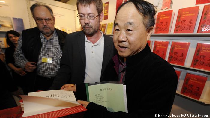 Chinese author Mo Yan autographs his book before taking part in a reading at the 61st Frankfurt Book Fair in Frankfurt October 15, 2009, where China is this year's guest of honour. Some 6,900 exhibitors from around 100 countries are to gather in Frankfurt until October 18. AFP PHOTO JOHN MACDOUGALL (Photo credit should read JOHN MACDOUGALL/AFP/Getty Images)
