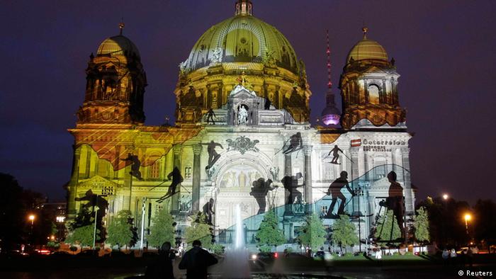 The Berliner Dom cathedral is illuminated during the opening day of the Festival of Lights in Berlin October 10, 2012. 68 landmarks of the German capital, including boulevards, squares, towers, historical and modern buildings, are illuminated during the festival that runs till October 21. REUTERS/Tobias Schwarz (GERMANY - Tags: SOCIETY ENTERTAINMENT CITYSCAPE)