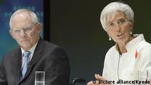  International Monetary Fund Managing Director Christine Lagarde (R) speaks during a debate session in Tokyo. To the left is German Finance Minister Wolfgang Schaeuble. Photo: picture alliance/Kyodo