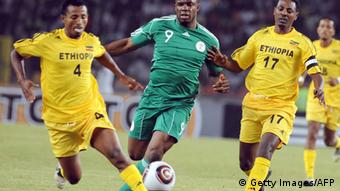  Nigeria's attacker Victor Anichebe (C) struggles for possession of ball with Ethiopian skipper Samson Gebreegziabher (R) and Abebaw Bune during the African Cup of Nations qualifying match between the two countries in Abuja Sunday, March 27, 2011. Nigeria defeated Ethiopia 4 - 0. AFP PHOTO/PIUS UTOMI EKPEI (Photo credit should read PIUS UTOMI EKPEI/AFP/Getty Images) 