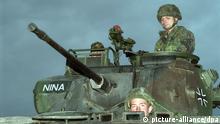 German soldiers atop a tank in Bosnia 
(Photo: dpa - Bildfunk)

