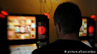A man plays a gambling machine