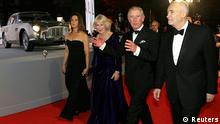 Britain's Prince Charles and Camilla, Duchess of Cornwall are escorted by producers Michael G. Wilson and Barbara Broccoli as they arrive for the royal world premiere of the new 007 film Skyfall at the Royal Albert Hall in London (Photo: REUTERS/Kirsty Wigglesworth)