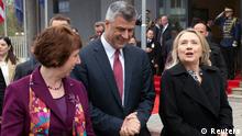 Kosovo's Prime Minister Hashim Thaci walks alongside U.S. Secretary of State Hillary Clinton (R) and EU Foreign Policy Chief Catherine Ashton (L) prior to a meeting at the Prime Minister's Office in Pristina October 31, 2012. Clinton's three-nation Balkan trip, probably her last before stepping down early next year, represents her final effort to settle some of the legacies of the bloody break-up of federal Yugoslavia in the 1990s, when her husband Bill Clinton was president. REUTERS/Saul Loeb/Pool (KOSOVO - Tags: POLITICS)