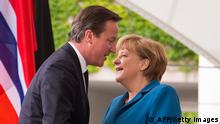German Chancellor Angela Merkel greets British Prime Minister David Cameron on (Photo: AFP PHOTO / CARSTEN KOALL/AFP/GettyImages) 
