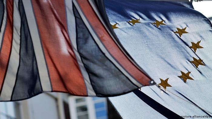 The British (L) and EU flags hang outside the Europe House in London, Britain, 09 December 2011. British Prime Minister David Cameron used his right to veto an EU-wide treaty change to tackle the eurozone crisis. Cameron said 09 December 'it was not in British interests'. A new 'accord' setting out tougher budget rules is to be drawn up for the eurozone countries, which all EU states, except the UK, look set to join. EPA/ANDY RAIN +++(c) dpa - Bildfunk+++
