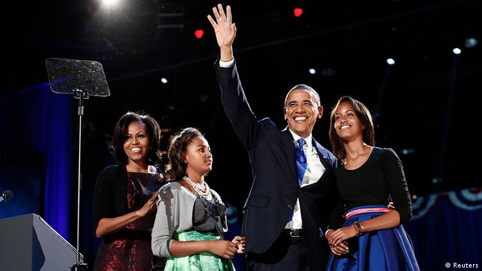U.S. President Barack Obama gathers with his wife Michelle Obama (L) and daughters Sasha and Malia (R) during his election night victory rally in Chicago November 7, 2012. REUTERS/Jason Reed (UNITED STATES - Tags: POLITICS USA PRESIDENTIAL ELECTION ELECTIONS)