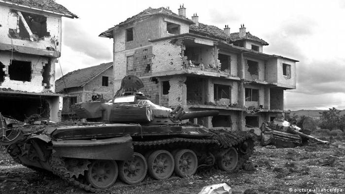 Russian tanks of the Yugoslav Army sit abandoned on Saturday, 19 June 1999 in the eastern Kosovar village of Klina after having been destroyed by NATO air strikes. The NATO international peacekeeping force for Kosovo (KFOR) confirmed 20 June 1999 that Yugoslav troops had completed their withdrawal from the Yugoslav province. dpa (Digitale Fortografie)
