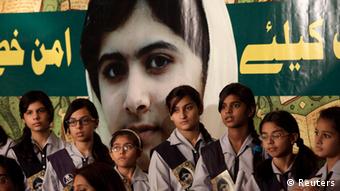 Pakistani students and teachers hold posters of 15-year-old Malala Yousufzai while they take part in a demonstration in Karachi, Pakistan on Saturday, Nov. 10, 2012. (Photo: Faree Khan/AP/dapd)