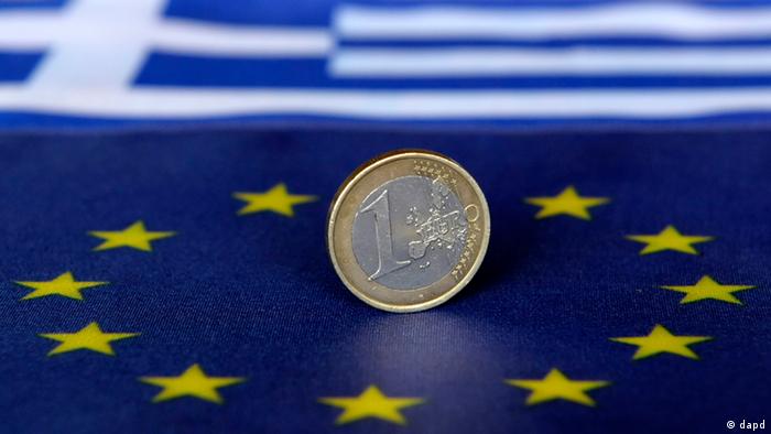 Euro coin on Greek flag