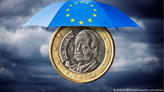 Spanish 1 euro coin, placed under an umbrella