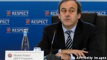 UEFA president France's Michel Platini looks on during the year's last meeting football's European governing body on December 6, 2012 in Lausanne. Platini and his executive council will make a decision whether to push ahead with the concept of changing tradition and hosting Euro 2020 across a number of European cities. The Frenchman first proposed the idea on the eve of the Euro 2012 final between eventual champions Spain and Italy. AFP PHOTO / FABRICE COFFRINI (Photo credit should read FABRICE COFFRINI/AFP/Getty Images) 