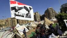 Anti-Morsi protesters with a flag that reads No, to Constitution
