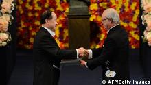 The 2012 Nobel Literature Prize winner Mo Yan of China (L) receives the Nobel Prize award from King Carl Gustaf of Sweden during an awarding ceremony on December 10, 2012 in Stockholm. The winners of the Nobel Prize 2012 in the categories of medicine, physics, chemistry, literature and economics receive their awards from the hands of Sweden's King Carl XVI Gustaf at a formal ceremony, followed by a gala banquet. AFP PHOTO/JONATHAN NACKSTRANDthe Nobel prize awarding ceremony on December 10, 2012 in Stockholm. The winners of the Nobel Prize 2012 in the categories of medicine, physics, chemistry, literature and economics receive their awards from the hands of Sweden's King Carl XVI Gustaf at a formal ceremony, followed by a gala banquet. AFP PHOTO/JONATHAN NACKSTRAND (Photo credit should read JONATHAN NACKSTRAND/AFP/Getty Images) 