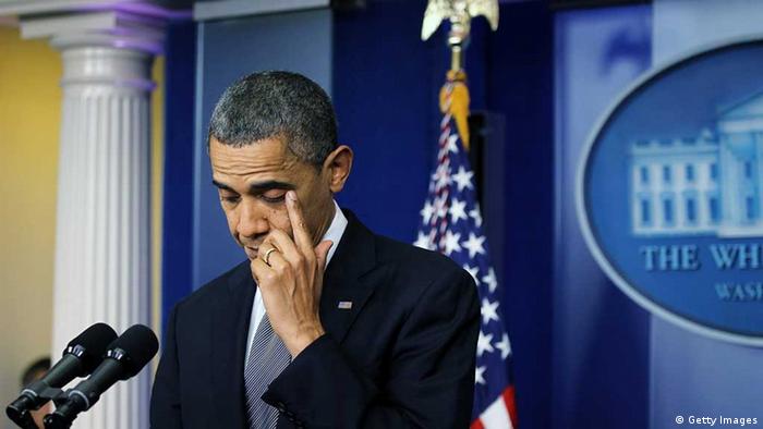 WASHINGTON, DC - DECEMBER 14: U.S. President Barack Obama wipes tears as he makes a statement in response to the elementary school shooting in Connecticut December 14, 2012 at the White House in Washington, DC. According to reports, there are about 27 dead, perhaps 17 of them children, after Ryan Lanza, 24, opened fire in at the Sandy Hook Elementary School in Newtown, Connecticut. Reports say that Lanza is dead at the scene and his mother, a teacher at the school, is also dead. (Photo by Alex Wong/Getty Images) 
