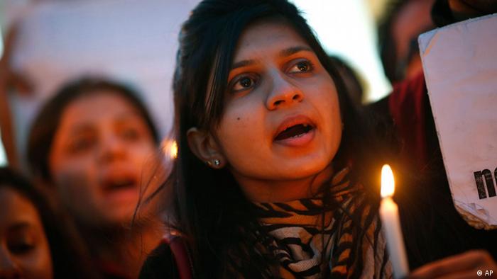 An Indian girl holds a candle during a candlelight vigil to seek capital punishment for rapists in New Delhi, India, Wednesday, Dec. 19, 2012. The hours-long gang-rape and near fatal beating of a 23-year-old student on a bus in New Delhi triggered outrage and anger across the country Wednesday as Indians demanded action from authorities who have long ignored persistent violence and harassment against women. (Photo:Saurabh Das/AP/dapd)