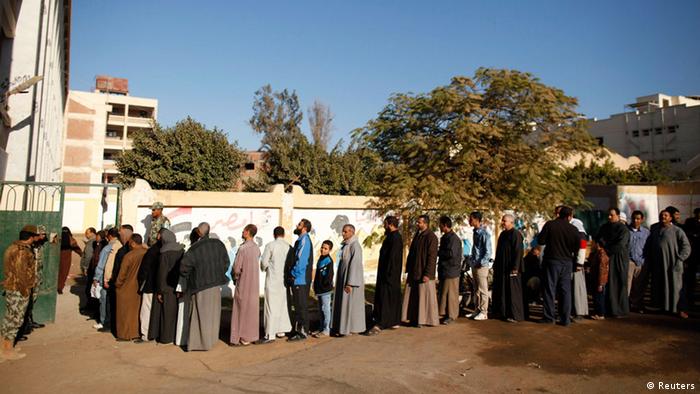 People to wait in line outiside a polling station in Giza, south of Cairo
Copyright: Khaled Abdullah/Reuters 