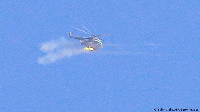 Syrian forces helicopter fires a rocket during clashes between government forces and rebels in the northeastern town of Ras al-Ain, near the Turkish border, on November 11, 2012. The Syrian Observatory for Human Rights reported that Kurdish residents backed by militia from the Democratic Union Party (PYD) had taken control of three towns near the border with Turkey after convincing pro-government forces to leave. AFP PHOTO / BULENT KILIC (Photo credit should read BULENT KILIC/AFP/Getty Images) 
