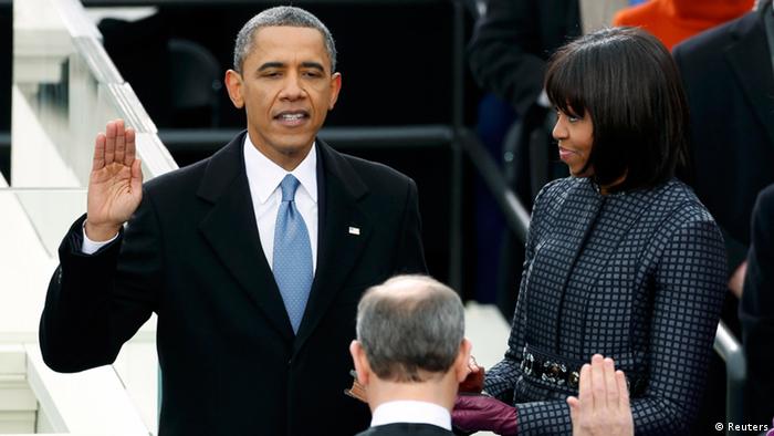 U.S. President Barack Obama (L) is sworn in by Supreme Court Justice John Roberts, as first lady Michelle Obama looks on during inauguration ceremonies in Washington, January 21, 2013