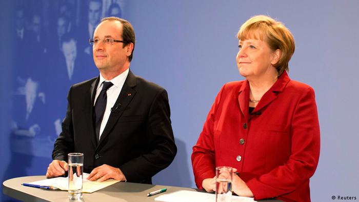 German Chancellor Angela Merkel and French President Francois Hollande speak during a meeting with some 200 German and French students and pupils as part of celebrations of the 50th anniversary of the Elysee Treaty, in the Chancellery in Berlin, January 21, 2013. (Photo: REUTERS/Kay Nietfeld/Pool)
