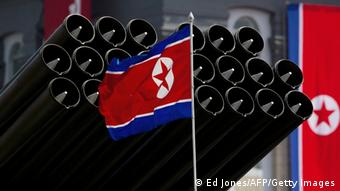 A North Korean flag flies before missiles displayed during a military parade to mark 100 years since the birth of the country's founder Kim Il-Sung in Pyongyang on April 15, 2012. ( Photo: Ed Jones/AFP/Getty Images)