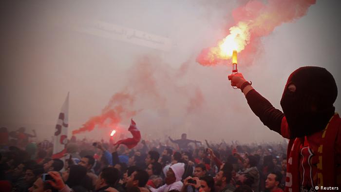 Al Ahly fans, also known as Ultras, celebrate and shout slogans in front of the Al Ahly club after hearing the final verdict of the 2012 Port Said massacre in Cairo January 26, 2013. (Photo: REUTERS/Amr Abdallah Dalsh)