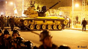 An Egyptian Army tank deploys as Egyptian protesters gather outside the presidential palace 
Photo:Hassan Ammar/AP/dapd