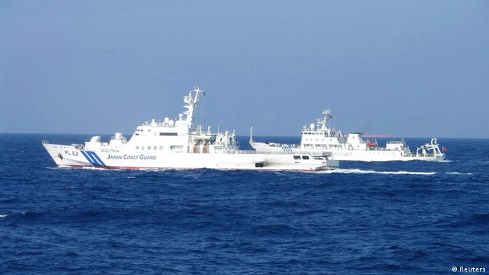 Chinese marine surveillance ship Haijian No. 51 (R) cruises next to a Japan Coast Guard patrol ship, Akaishi, in the East China Sea near the disputed isles known as Senkaku isles in Japan and Diaoyu islands in China, in this handout photo released by the 11th Regional Coast Guard Headquarters-Japan Coast Guard February 4, 2013. Photo: REUTERS/11th Regional Coast Guard Headquarters-Japan Coast Guard/Handout (JAPAN - Tags: POLITICS) ATTENTION EDITORS - THIS IMAGE WAS PROVIDED BY A THIRD PARTY. FOR EDITORIAL USE ONLY. NOT FOR SALE FOR MARKETING OR ADVERTISING CAMPAIGNS. THIS PICTURE IS DISTRIBUTED EXACTLY AS RECEIVED BY REUTERS, AS A SERVICE TO CLIENTS. MANDATORY CREDIT