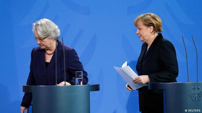 German Chancellor Angela Merkel (R) and Education Minister Annette Schavan leave after a statement to the media in Berlin February 9, 2013. Germany's education minister resigned on Saturday after being stripped of her doctorate over plagiarism charges, an embarrassment for her close confidante Chancellor Angela Merkel who is campaigning to win a third term in office this year. REUTERS/Tobias Schwarz (GERMANY - Tags: POLITICS)