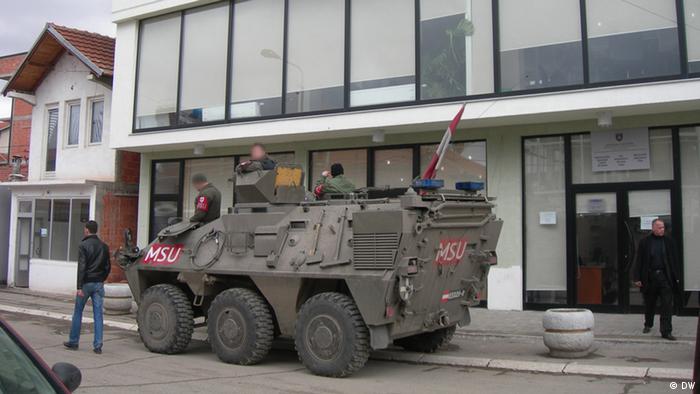 A KFOR tank stationed outside the city center in Mitrovica