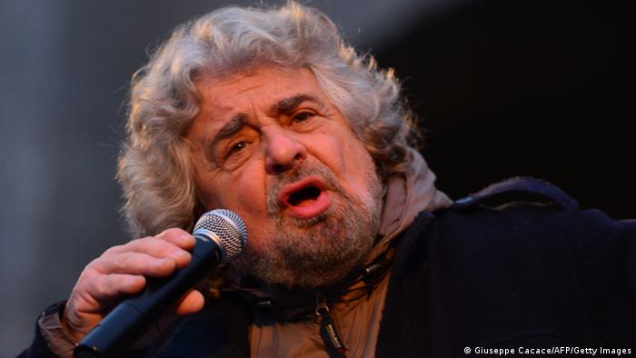 The head of the populist Five Star Movement, comedian Beppe Grillo, whose has been winning votes among those critical of Monti's austerity policy, addresses supporters during an electoral rally on February 12, 2013 in Bergamo, northern Italy. Comedian-turned-politician Beppe Grillo is candidate to the general elections on February 24-25. AFP PHOTO / GIUSEPPE CACACE (Photo credit should read GIUSEPPE CACACE/AFP/Getty Images) 