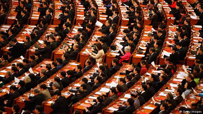  Delegates take their seats for the closing session of the National Peoples Congress (NPC) at The Great Hall Of The People on March 14, 2012 in Beijing, China. The National People's Congress (NPC), China's parliament, adopted the revision to the Criminal Procedure Law at the closing session of its annual session today. (Photo by Lintao Zhang/Getty Images) 