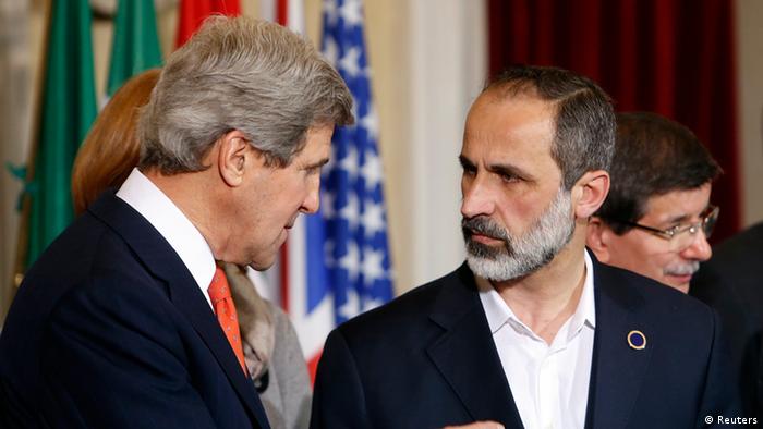 US Secretary of State John Kerry (L) talks with New Syrian National Coalition head Mouaz al-Khatib during a meeting at Villa Madama in Rome, February 28, 2013. REUTERS/Remo Casilli (ITALY - Tags: POLITICS)