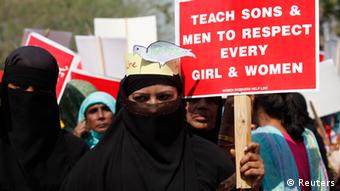 Activist hold placards as they take part in a rally to commemorate International Women's Day in Lahore March 8, 2013. (Photo: REUTERS/Mohsin Raza)