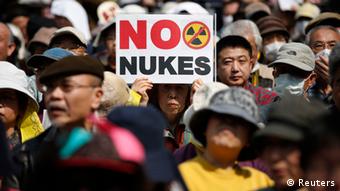 Anti-nuclear protesters attend a rally in Tokyo March 10, 2013, a day before the second-year anniversary of the March 11, 2011 earthquake and tsunami that killed thousands and set off a nuclear crisis. On March 11, 2013, Japan will mark two years since the disaster which set off a radiation crisis that shattered public trust in atomic power and the nation's leaders. REUTERS/Issei Kato (JAPAN - Tags: POLITICS DISASTER ANNIVERSARY)