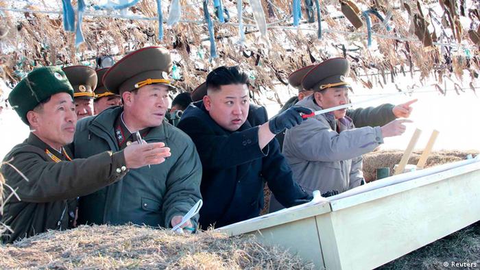 North Korean leader Kim Jong-Un (C) visits the Wolnae Islet Defence Detachment in the western sector of the front line, which is near Baengnyeong Island of South Korea March 11, 2013 in this picture released by the North's official KCNA news agency in Pyongyang March 12, 2013. South Korea and U.S. forces are conducting large-scale military drills, while the North is also gearing up for a massive military exercise. North Korea has accused the U.S. of using the military drills in the South as a launch pad for a nuclear war and has said to scrap the armistice with the U.S. that ended the 1950-53 Korean War. REUTERS/KCNA (NORTH KOREA - Tags: POLITICS MILITARY TPX IMAGES OF THE DAY CIVIL UNREST)<br />ATTENTION EDITORS - THIS PICTURE WAS PROVIDED BY A THIRD PARTY. REUTERS IS UNABLE TO INDEPENDENTLY VERIFY THE AUTHENTICITY, CONTENT, LOCATION OR DATE OF THIS IMAGE. THIS PICTURE IS DISTRIBUTED EXACTLY AS RECEIVED BY REUTERS, AS A SERVICE TO CLIENTS. QUALITY FROM SOURCE. NO THIRD PARTY SALES. NOT FOR USE BY REUTERS THIRD PARTY DISTRIBUTORS