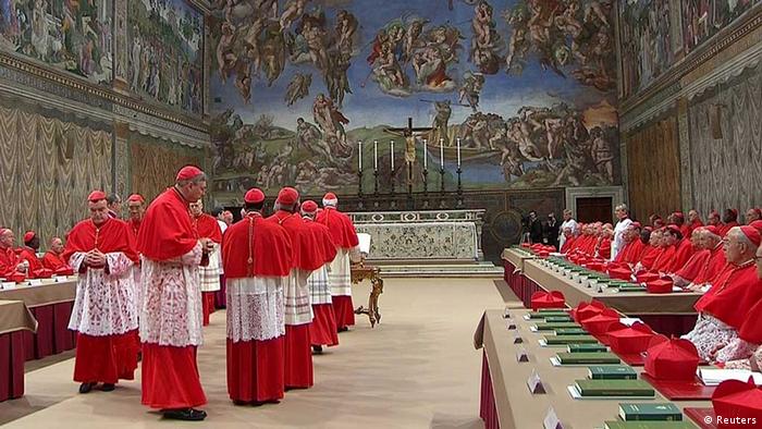 Cardinals enter the Sistine Chapel to begin the conclave in order to elect a successor to Pope Benedict, in a still image taken from video at the Vatican March 12, 2013. Shut off from the outside world, the 115 cardinals will cast their ballots in a chapel which has Michelangelo's soaring Last Judgment on one wall, and his depiction of the hand of God giving life to Adam above them. REUTERS/Vatican CTV via Reuters Tv (VATICAN - Tags: RELIGION) FOR EDITORIAL USE ONLY. NOT FOR SALE FOR MARKETING OR ADVERTISING CAMPAIGNS.
