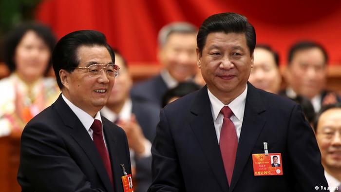 Hu Jintao (L) shakes hands with China's newly elected President and chairman of the Central Military Commission Xi Jinping during the fourth plenary meeting of the first session of the 12th National People's Congress (NPC) in Beijing, March 14, 2013. (Photo: Reuters)