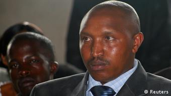 Fugitive Congolese warlord Bosco Ntaganda attends rebel commander Sultani Makenga's wedding in Goma December 27, 2009. Ntaganda walked into the U.S. Embassy in Rwanda on March 18, 2013 and asked to be transferred to the International Criminal Court, where he faces war crimes charges racked up during years of rebellion. Picture taken December 27, 2009. REUTERS/Paul Harera (DEMOCRATIC REPUBLIC OF CONGO - Tags: CIVIL UNREST CRIME LAW MILITARY POLITICS SOCIETY)
