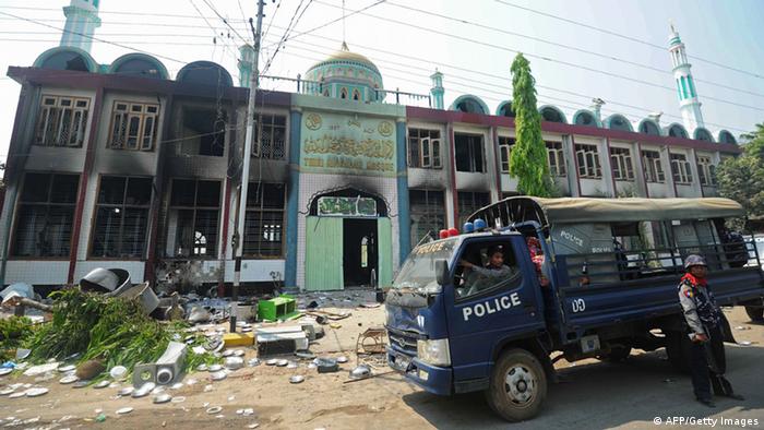 GettyImages 164264830
Policemen stand guard outside a partially-burnt mosque in riot-hit Meiktila, central Myanmar on March 22, 2013. 