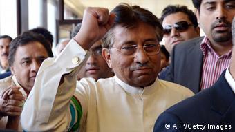 Pervez Musharraf gestures upon his arrival at the Karachi International airport from Dubai, in Karachi on March 24, 2013. (Photo: AAMIR QURESHI/AFP/Getty Images)