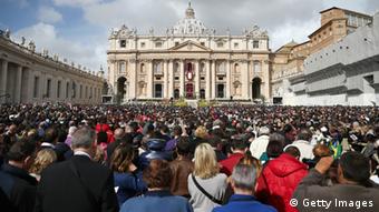 A general view of crowds as Pope Francis appears prior to delivering his first 'Urbi et Orbi' blessing from the balcony of St. Peter's Basilica during Easter Mass on March 31, 2013 in Vatican City, Vatican. Pope Francis delivered his message to the gathered faithful from the central balcony of St. Peter's Basilica in St. Peter's Square after his first Holy week as Pontiff. 
(Photo by Dan Kitwood/Getty Images) 