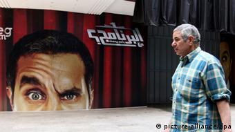 A poster in Cairo featuring Egyptian comedian Bassem Youssef