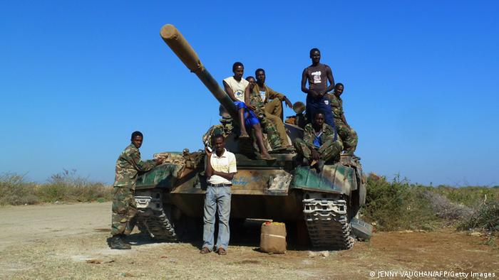 A picture taken on March 2, 2012 shows Ethiopian troops standing on an army tank at an air base in the city of Baido, which was taken over from Shebab rebels on February 22. Truckloads of Ethiopian and Somali troops on February 22 captured the strategic Somali city of Baidoa from Al-Qaeda-allied Shebab insurgents, who vowed to avenge their biggest loss in several months. Baidoa, 250 kilometres (155 miles) northwest of the capital Mogadishu, was the seat of Somalia's transitional parliament until the hardline Shebab captured it in 2009. Ethiopia says it is in the country to support Somalia?s transitional government to stamp out Shebab insurgents, but says it does not plan to remain in the country for the long term. AFP PHOTO / JENNY VAUGHAN (Photo credit should read JENNY VAUGHAN/AFP/Getty Images)