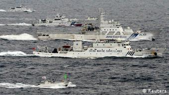 An aerial photo shows a Chinese marine surveillance ship Haijian No. 66 (C) cruising next to Japan Coast Guard patrol ships in the East China Sea, near known as Senkaku isles in Japan and Diaoyu islands in China, in this photo taken by Kyodo April 23, 2013
(Photo: REUTERS/Kyodo)