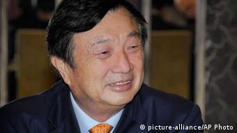 In this photo released by Huawei Technologies Co., Ren Zhengfei, CEO and founder of Huawei based in Shenzhen, China, smiles during his meeting with local media Thursday, May 9, 2013 in Wellington, New Zealand. Ren said the company is committed to bringing value and contributing to New Zealand’s digital economy. (AP Photo/Huawei Technologies Co.)