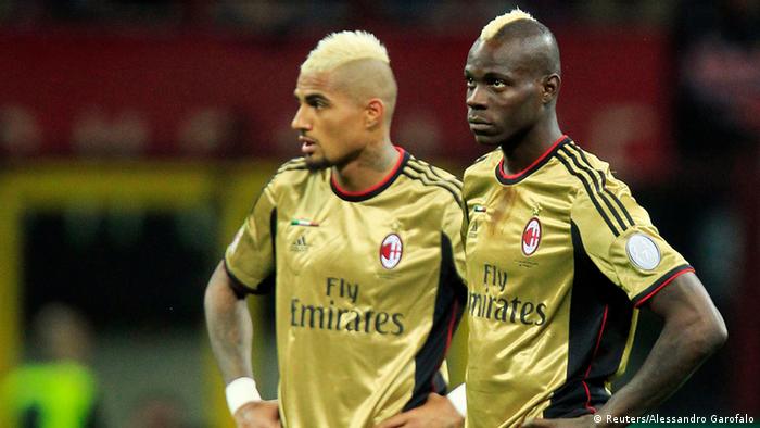 AC Milan's Boateng and Balotelli look on as referee Rocchi suspends the match due to racist chants during their Italian Serie A soccer match against AS Roma in Milan
AC Milan's Kevin-Prince Boateng (L) and Mario Balotelli look on as referee Gianluca Rocchi suspends the match due to racist chants during their Italian Serie A soccer match against AS Roma at the San Siro stadium in Milan May 12, 2013. REUTERS/Alessandro Garofalo (ITALY - Tags: SPORT SOCCER TPX IMAGES OF THE DAY)